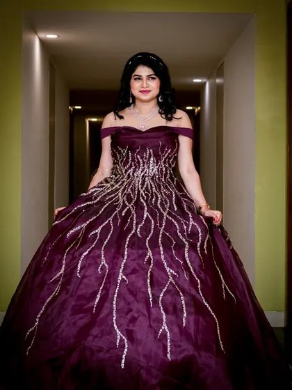 A welcoming, direct portrait of the bride-to-be. This photo showcases her beautiful gown and happy expression, perfectly capturing the celebratory mood of her reception.