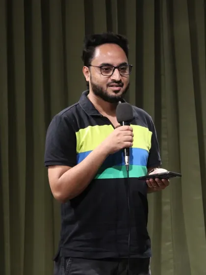 A comedian engaging with the crowd during a fun-filled open mic night.
