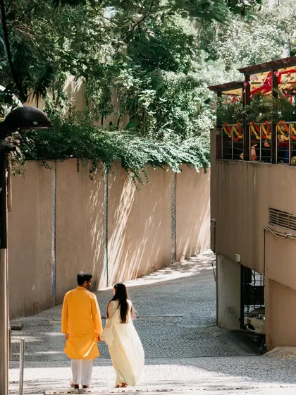 A quiet moment of reflection and togetherness, as the couple walks hand-in-hand.