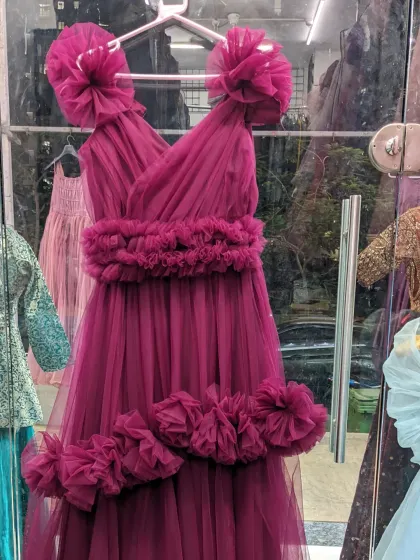 This magenta ruffle gown is another of my versatile photoshoot dresses. The ruffles can be arranged in different ways, and it comes with a detachable tail for multiple looks.