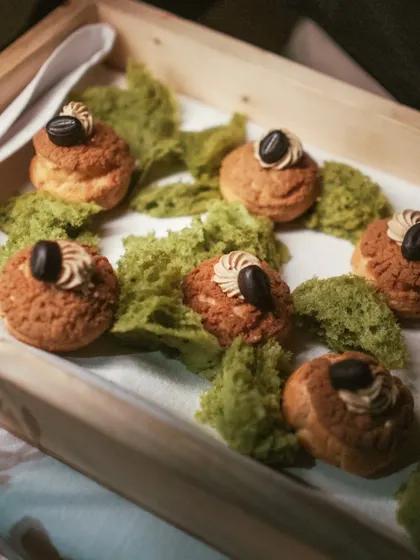Chic choux pastries filled with an indulgent coffee mousse and served on a bed of pistachio moss. A perfect pick-me-up dessert.