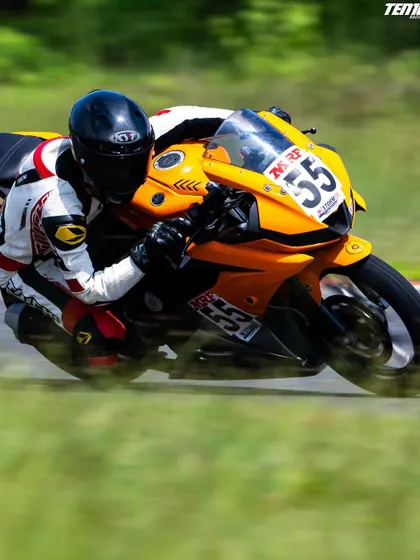The blur of the track signifies the incredible speeds of motorcycle racing. Our training ensures riders are comfortable and in control, even when pushing the limits of traction.