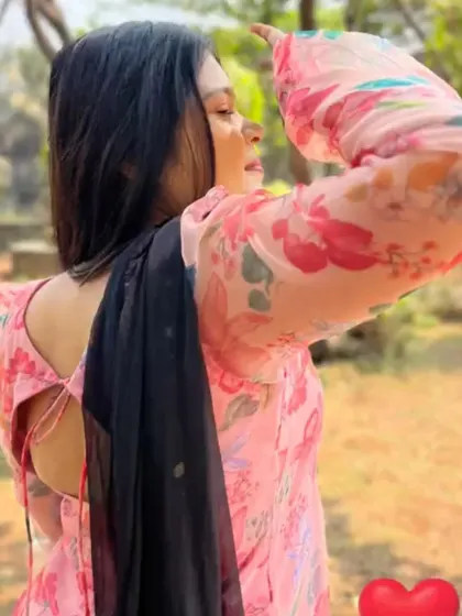 This photo shows the back detail of the organza kurta, which features a simple tie-up design. It's these little details that make a custom outfit feel special.