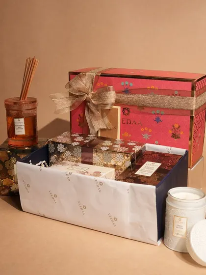 This vibrant gift set is filled with an assortment of our fragrant treasures. It includes a reed diffuser, a hand-poured candle, room spray, and more, all nestled in our signature patterned box, ready to delight.