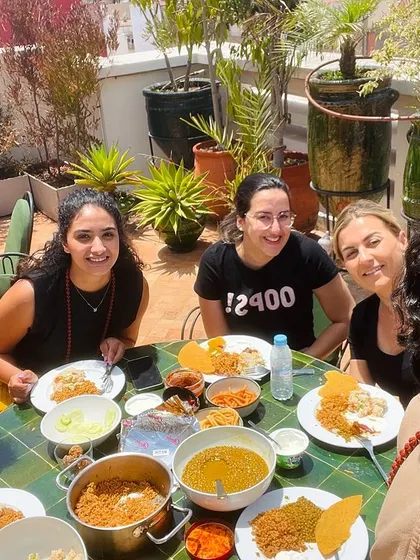 Sharing a home-cooked Indian meal with my students on the rooftop in Casablanca.