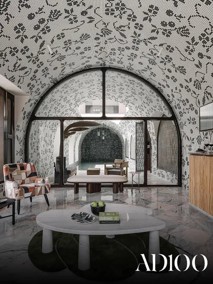 An indoor pool area with intricate mosaic-tiled, vaulted ceilings, featured in AD100.