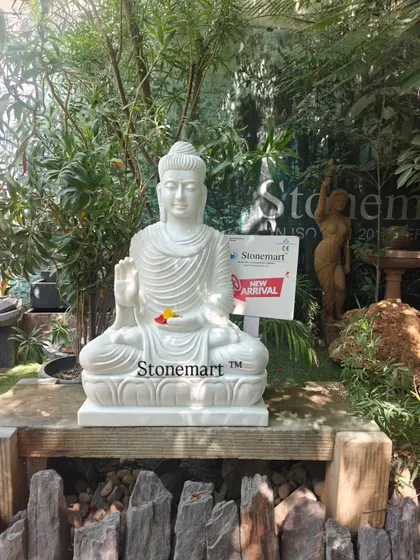 Another view of our 3-foot, 180 kg white marble Buddha statue. The fine details in the robes and facial expression are a testament to the skill of our carvers.