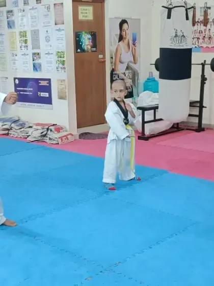 Even our youngest students show great focus while practicing their punches.