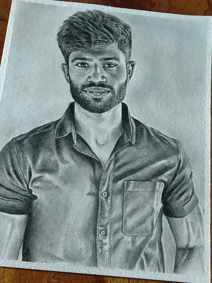 A commissioned portrait of a man with a beard, focusing on a natural and friendly expression.