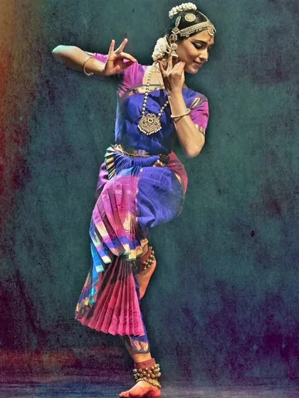 A student in a colorful costume, a beautiful example of the work of our cherished tailor, Manjunath.