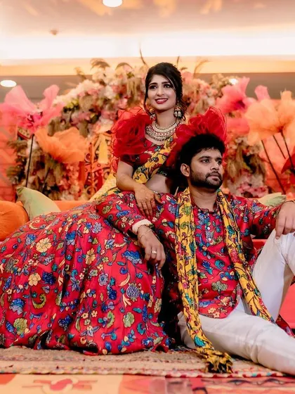 A lovely portrait of the couple during their Mehendi function. The decor, with its warm tones and eclectic elements, provides a stunning setting for their photos.
