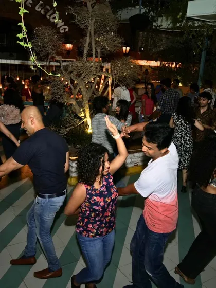A wide shot of the dance floor, showing the vibrant and crowded atmosphere.