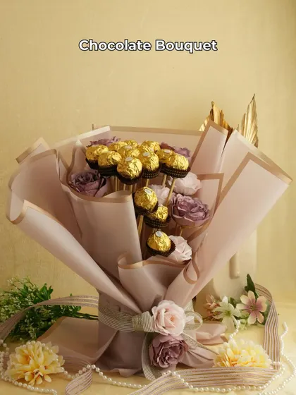 A classic that never fails to delight. This elegant chocolate bouquet features Ferrero Rocher chocolates mixed with artificial roses, beautifully wrapped for a perfect anniversary or Valentine's gift.