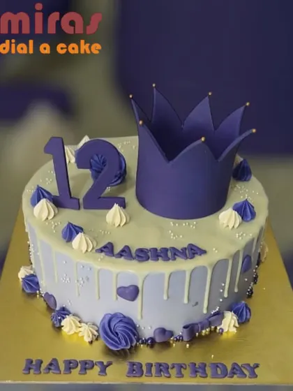 A royal purple-themed cake for a 12th birthday. This design includes a purple crown, a lavender drip effect, and matching purple and white frosting details.