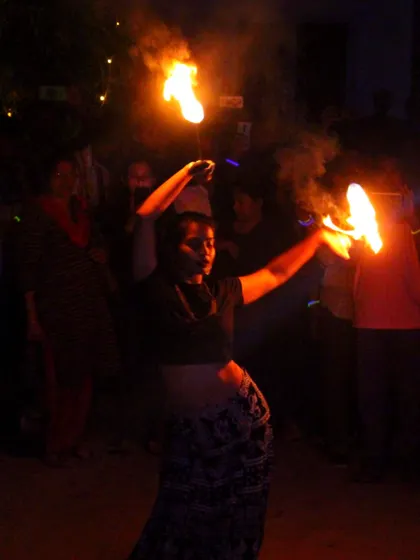 A fire dancer entertains the crowd at our New Year's Eve beach party in Gokarna, adding a spectacular element to the celebration.