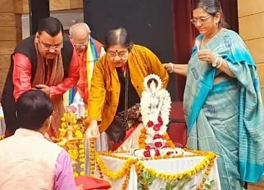 Participating in the lamp lighting ceremony to inaugurate the Sangeet Milon competition.