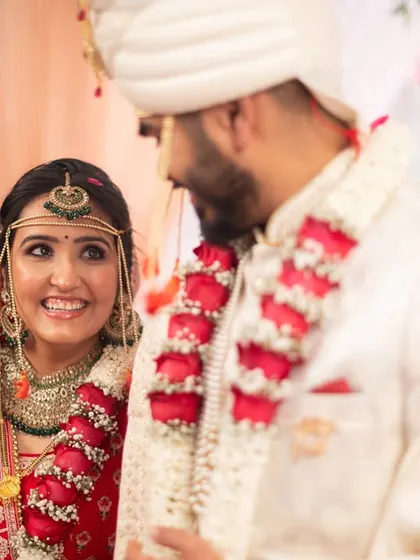 The bride's radiant smile as she looks at her groom during the ceremony.