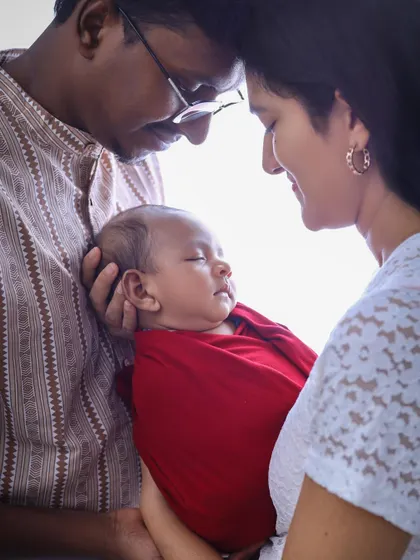A serene and intimate moment between new parents and their sleeping baby. We aim to capture the overwhelming love and peace of these early days.