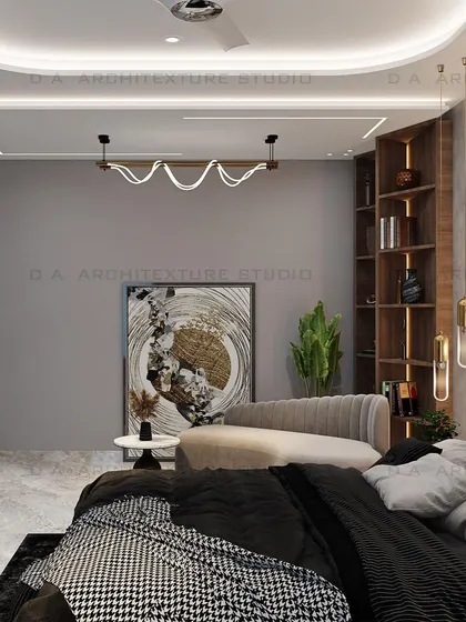 A beige-themed master bedroom from the same project, showcasing a custom bookshelf and a cozy chaise lounge, creating a perfect reading nook.
