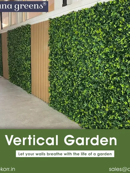 In this long corridor, I used panels of lush artificial greenery alternated with WPC fluted panels. This breaks the monotony of the long wall and adds both texture and a refreshing natural element to the commercial space.