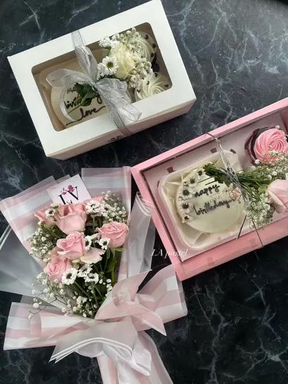 More than just cake, I create full gift experiences. This hamper includes a mini cake and cupcakes, beautifully packaged with a fresh flower bouquet to make someone's day.