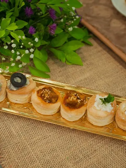A variety platter of my vol-au-vents, or puff pastry cups. This selection shows different fillings, including creamy mushroom, a savory mince, and a fresh salsa.