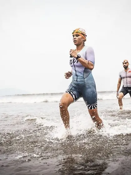 Exiting the water at Ironman Goa. This is a critical moment to get your land legs back and prepare for the long bike ride ahead.