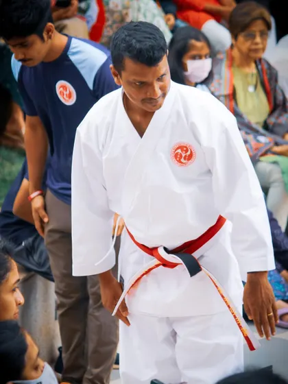 An instructor shows respect with a bow during a demonstration, modeling the humility and character we aim to build in all our students.