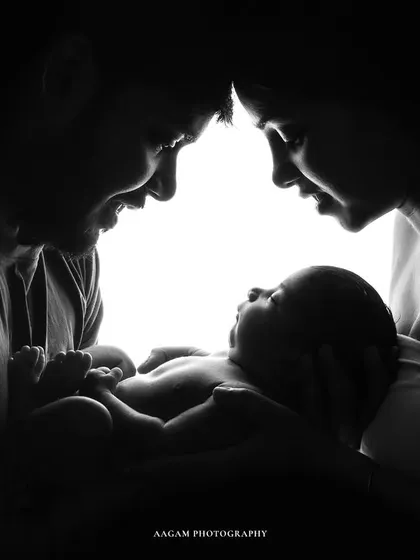 Another beautiful family silhouette in black and white. The light shining from behind them creates a halo effect, symbolizing the miracle of their new baby.