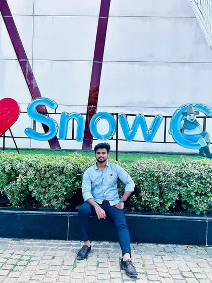 Sitting by the Snow City entrance sign.
