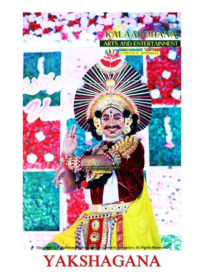 Our Yakshagana artist strikes a classic pose against a festive backdrop. We adapt our performances to suit any occasion, ensuring the visual splendor of the art form shines through.