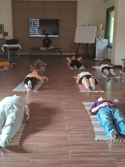 After an engaging session on Shuddhi Kriyas and asanas, students from Adelphi University rest in Savasana. This period of integration is crucial for absorbing the physical and energetic benefits of the practice.