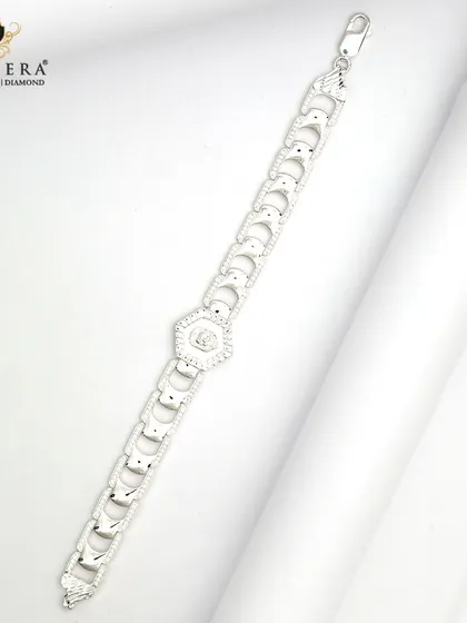 This men's silver bracelet features bold, geometric links with a central hexagonal charm. It's a stylish piece for the man who wants his wrist to have a little sparkle.