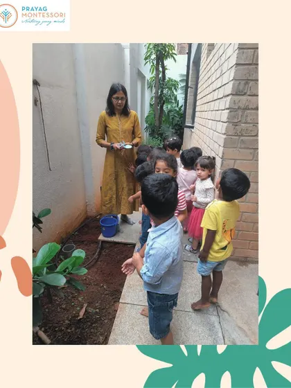 Our students gather around to learn about gardening, a hands-on science lesson right in our own backyard.