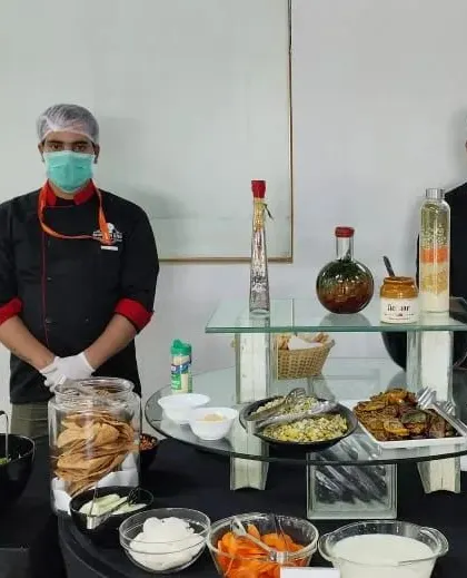 Our professional chefs in uniform, ready to serve at a corporate event. Their expertise and courteous service are a key part of the Brunch N Bite experience.