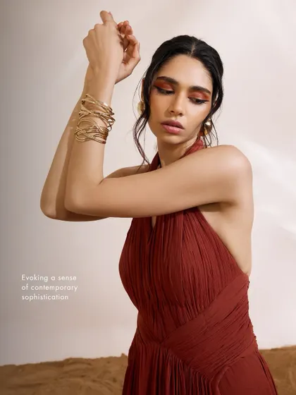 A closer look at the Luna Dress, highlighting the intricate pleating on the bodice. This detail adds texture and sophistication to the contemporary design.