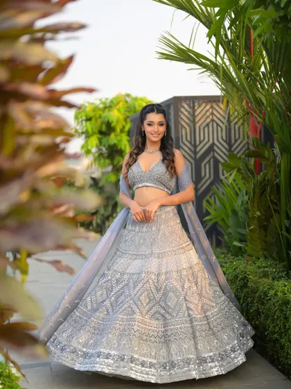 A full-length shot showing the entire luminous look. The makeup, hair, and outfit come together to create a truly magical and glamorous transformation.