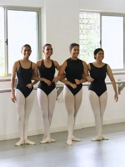 A moment of shared understanding and joy between our senior dancers. The camaraderie built in the studio is just as important as the technique learned.