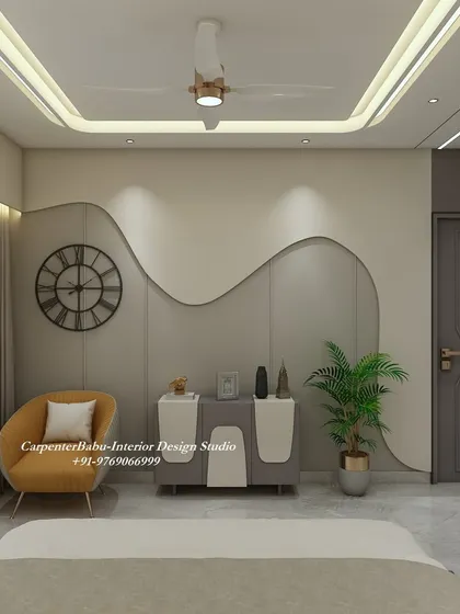 This bedroom wall features a beautiful, flowing design that adds a soft, organic touch to the room. The simple console and armchair complete the serene look.