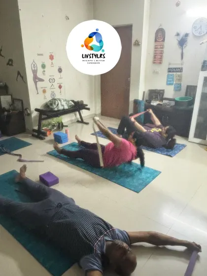 A group session focused on flexibility and recovery. Using yoga straps allows for deeper, safer stretches, helping to release tension in the hamstrings and lower back after a workout.