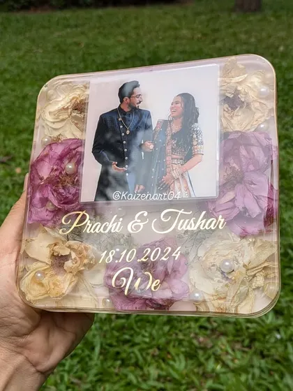 This image showcases three types of wedding art I offer: engagement ring platters, resin Kankotris, and wedding flower preservation frames. Each piece is fully customizable to match your wedding theme and style.