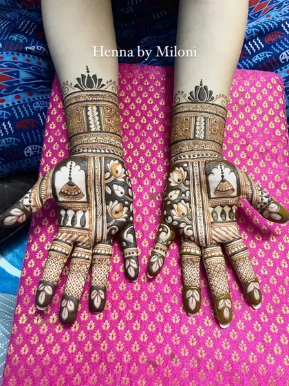 A beautiful design with temple bells (jhumkas) and lotus flowers, creating a very delicate and feminine look.