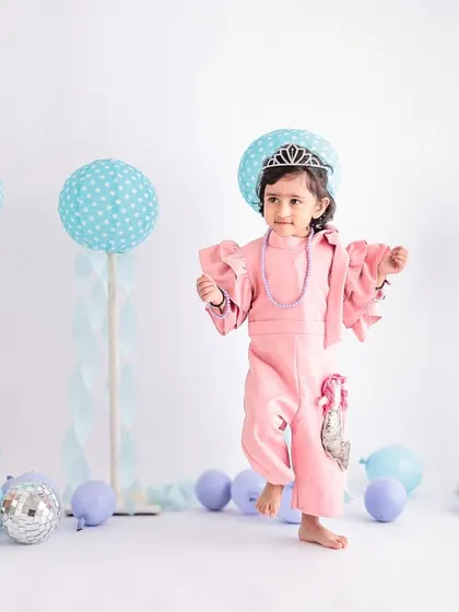Caught in a moment of dance, this shot from a second birthday photoshoot is full of energy and movement. We create a relaxed environment where kids feel free to be themselves.
