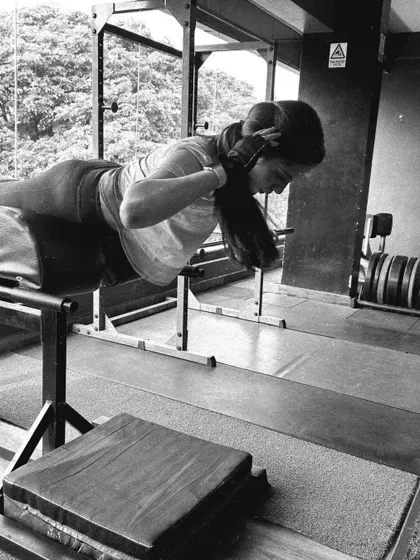 A client performs a back extension, an important exercise for strengthening the lower back and posterior chain.