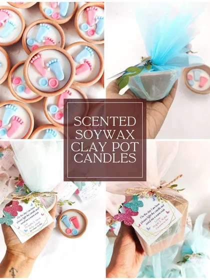 More examples of the baby feet clay pot candles, including shots of the final packaged gift, wrapped in blue net with a custom tag.