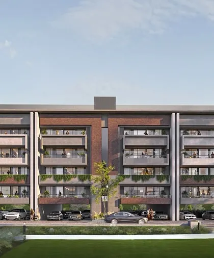 This street-level view of Gulnaar Lifestyle shows how the design fosters community living with accessible green spaces and interconnected buildings.