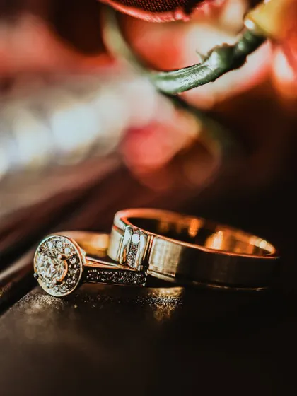 A symbol of a lifelong promise. This detailed shot of the wedding rings showcases my focus on every element of your day. I believe that even the smallest details, like the cut of a diamond and the texture of the bands, are part of your grand story and deserve to be captured beautifully.
