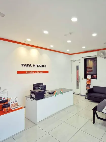The parts and accessories sales counter. The design is clean and organized, reflecting the efficiency and reliability of the Tata Hitachi brand.