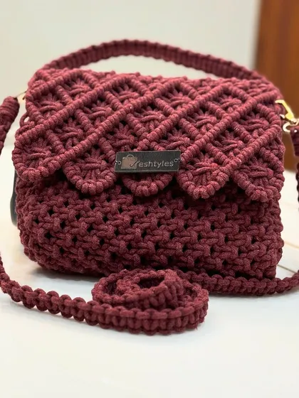This maroon version of the scalloped flap bag is perfect for the festive season.