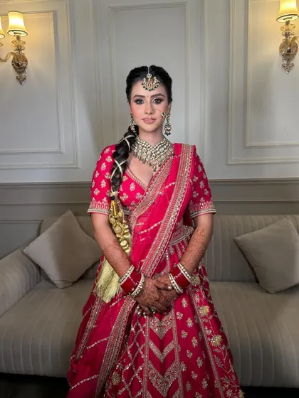 A full-length shot capturing the elegance and grace of our Sikhni bride in her beautiful pink lehenga and our exquisite jewellery.